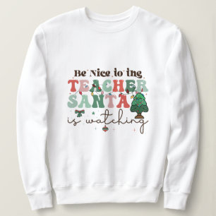 Sudadera Sé amable con el profesor que Santa está mirando