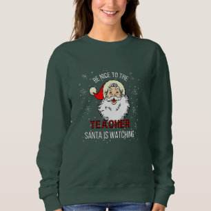 Sudadera Sé amable con el profesor que Santa está viendo