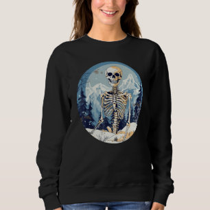 Sudadera Sonriente esqueleto frente a las montañas en invie