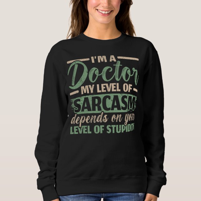 Sudadera Soy un Médica Mi Nivel De Sarcasmo Depende De Tu S (Anverso)