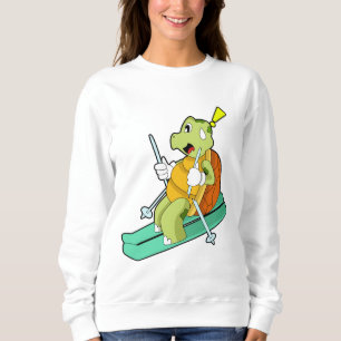Sudadera Tortuga como esquiadora con esquí