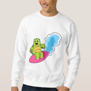 Sudadera Tortuga como surfista con tabla de surf
