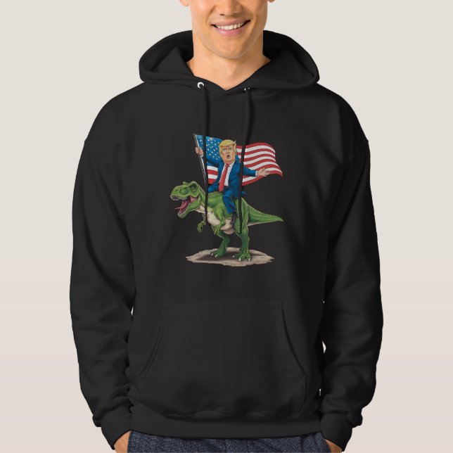 Sudadera Trump montando dinosaurio T Rex bandera estadounid (Anverso)