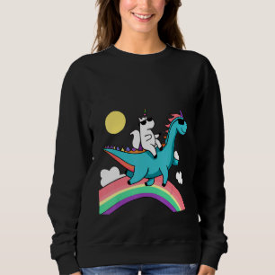 Sudadera unicornio con gafas de sol montando un dinosaurio