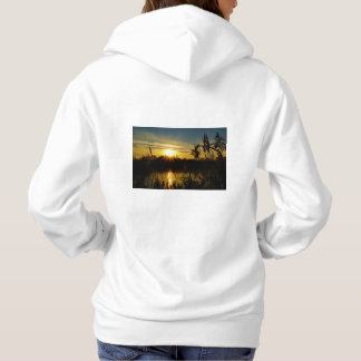 Sudadera Zonsondergang bij een meertje met rietpluimen.