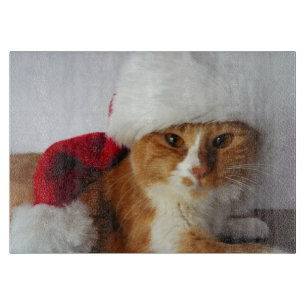 Tabla de cortar con gato lindo que lleva sombrero