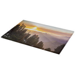 Tabla De Cortar El atardecer sobre el bosque