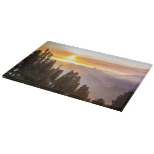 Tabla De Cortar El atardecer sobre el bosque