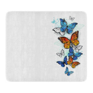 Tabla De Cortar Morfo y monarca de las mariposas voladoras