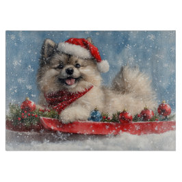 Tabla De Cortar Perro Keeshond en la manga que nieva a los Navidad