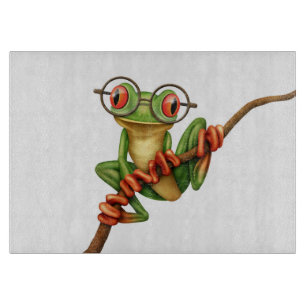 Tabla De Cortar Rana arbórea verde linda con los vidrios del ojo