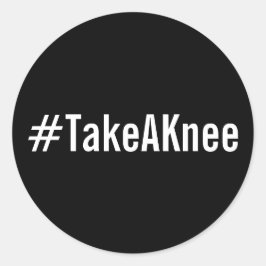 #TakeAKnee, texto blanco en negrita sobre pegatina