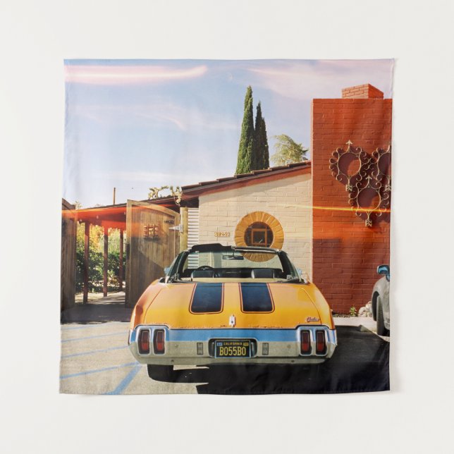 Tapiz Auto azul estacionado al lado de un edificio de ho (Anverso)