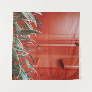 Tapiz Planta verde sobre sofá rojo