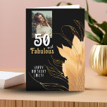 Tarjeta 50 y Fabulous Gold Foliage 50th Birthday Photo<br><div class="desc">Elegante tarjeta fotográfica de 50 años y fabulosa Foliage de 50 años. 50 y texto fabuloso en escritura blanca a la moda con un nombre y follaje dorado sobre un fondo negro. Personalízalo con tu foto,  tu nombre y la edad. Agrega tu texto dentro de la tarjeta o borra.</div>