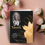 Tarjeta 90 y Fabulous Gold Foliage 90th Birthday Photo<br><div class="desc">Elegante 90 y fabulosa tarjeta fotográfica de cumpleaños 90. 90 y texto fabuloso en escritura blanca a la moda con un nombre y follaje dorado sobre un fondo negro. Personalízalo con tu foto,  tu nombre y la edad. Agrega tu texto dentro de la tarjeta o borra.</div>