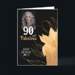 Tarjeta 90 y Fabulous Gold Foliage 90th Birthday Photo<br><div class="desc">Elegante 90 y fabulosa tarjeta fotográfica de cumpleaños 90. 90 y texto fabuloso en escritura blanca a la moda con un nombre y follaje dorado sobre un fondo negro. Personalízalo con tu foto,  tu nombre y la edad. Agrega tu texto dentro de la tarjeta o borra.</div>