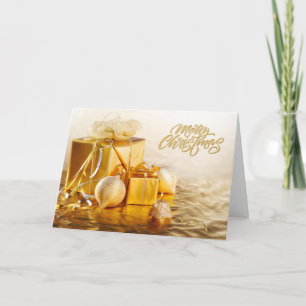 Tarjeta Adornos dorados y cajas de regalo de Navidad alegr