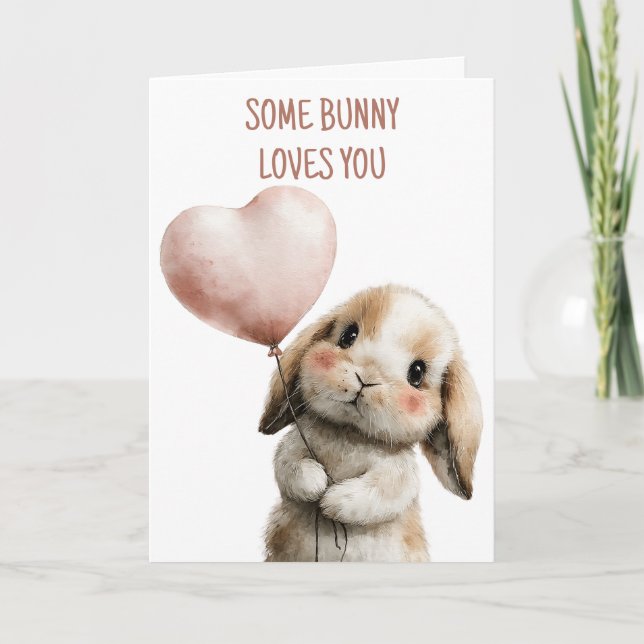Tarjeta Algun conejo te ama con globo de corazón (Anverso)