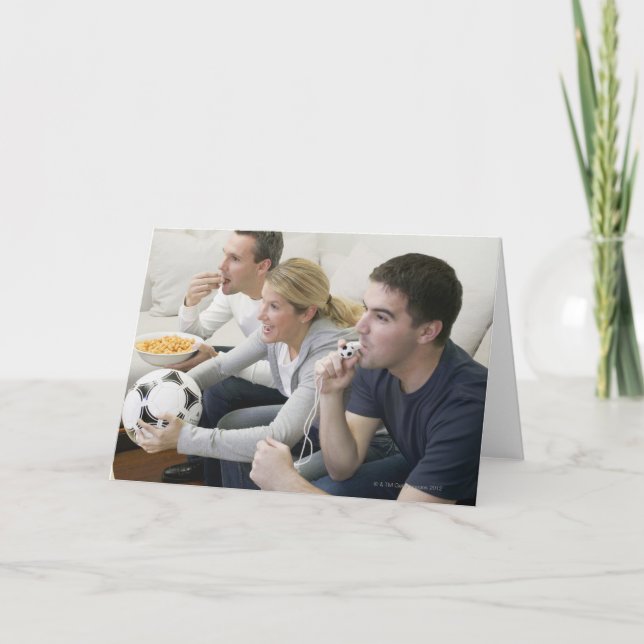 Tarjeta Amigos que ven la TV con el silbido, fútbol y (Anverso)