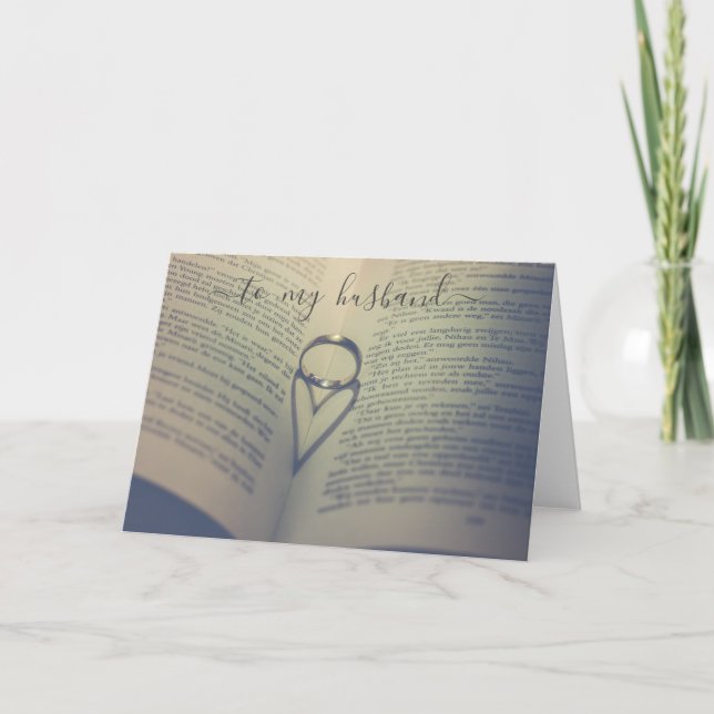 Tarjeta Anillo de boda sobre libro abierto cumpleaños o an (Anverso)