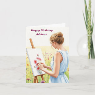 Tarjeta Artista pintando flores en campo Cumpleaños