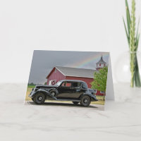 Auto negro vintage con arcoiris