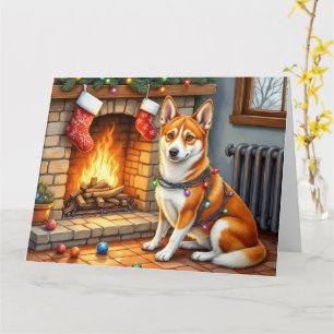 Tarjeta Basenji sentado junto a la chimenea con luces de N