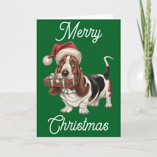 Tarjeta Basset Hound con sombrero de Santa con regalo en l (Anverso)