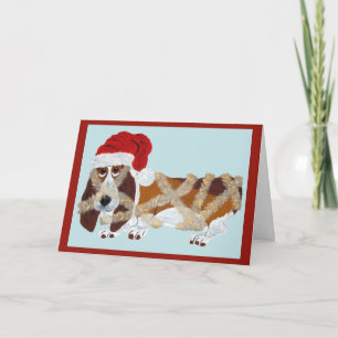 Tarjeta Basset Hound enredado en espumillón