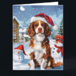Tarjeta Brittany Spaniel Dog Winter Wonderland Navidades<br><div class="desc">Este diseño festivo capta el alegre espíritu de la temporada navideña, con un adorable cachorro vestido con un sombrero de Santa. El perro está enclavado en un maravilloso país invernal, con un muñeco de nieve, un árbol de Navidad decorado y regalos hermosamente envueltos. Los copos de nieve caen suavemente, añadiendo...</div>