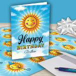 Tarjeta Brother Birthday Cute Sun<br><div class="desc">Haga que su hermano se sienta especial en su cumpleaños enviándole este alegre y sonriente sol decorativo amarillo y naranja flotando en el cielo azul con nubes. El texto interior dice "El sol empezó a brillar un poco más el día en que naciste". ¿Está interesado en combinar papel de embalaje?...</div>