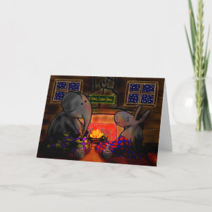 Tarjeta burro y elefante junto al fuego