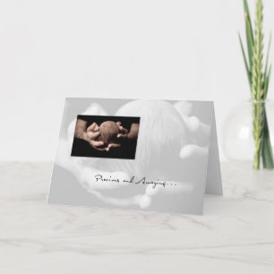 Tarjeta Cabeza de bebé en manos felicitaciones