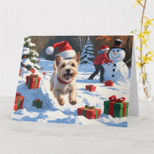 Tarjeta Cairn Terrier corre en nieve con Gorra de Navidade