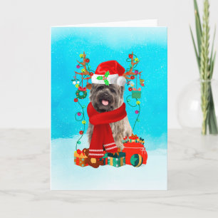 Tarjeta Cairn Terrier en la nieve con regalos de Navidades