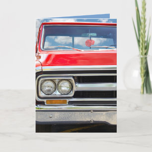 Tarjeta camión retro rojo con los dados borrosos