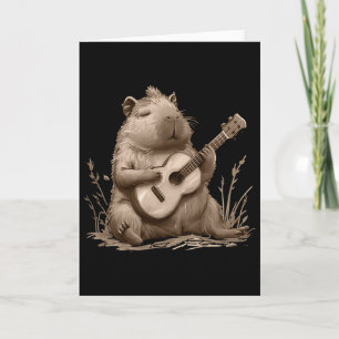 Tarjeta Capyra tocando el ukulele y gamer de videojuegos l