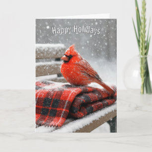Tarjeta Cardenal rojo de Navidad en una manta de cuadros n