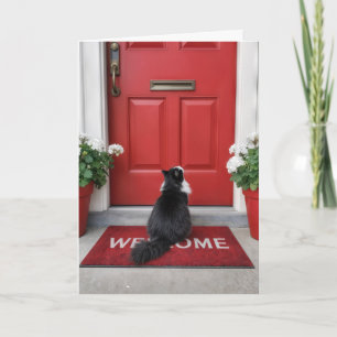 Tarjeta Casa nueva con gato en una alfombra de bienvenida 