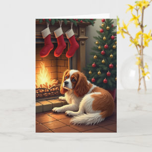 Tarjeta Cavalier King Charles junto a la chimenea Navidad