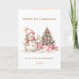 Tarjeta Chica de Snowman rosa la primera Navidad doblada