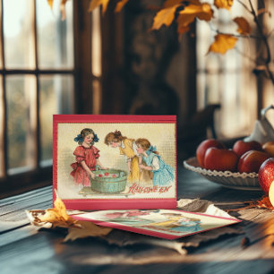 Tarjeta Chicas vintage de Halloween buscando manzanas