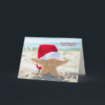 Tarjeta Christmas starfish with Santa hat<br><div class="desc">Starfish wearing red and white fur Santa hat on ocean beach</div>