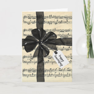 Tarjeta Cinta Negra de Aniversario en Partitura