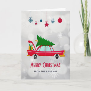 Tarjeta Coche rojo retro que lleva un árbol de Navidad
