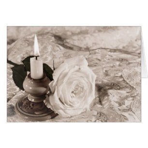 Tarjeta con un rosa antiguo y una vela