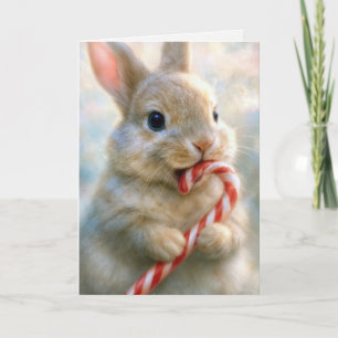 Tarjeta Conejo de Pascua mordisqueando un bastón de carame