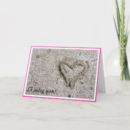Tarjeta Corazón romántico en una foto de arena con marco s