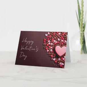 Tarjeta Corazones de chocolate rosa sobre fondo oscuro San